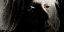 a close up of a man 's face with the caption johnnydepp_gifs below it