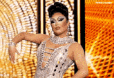 a woman in a silver dress is dancing in front of a t4yce tumblr banner