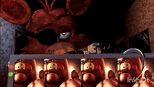 a video of foxy from five nights at freddy 's is being played on a tablet