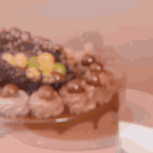 a close up of a cake on a table with a blurry background