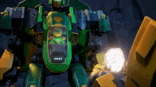 a green and yellow robot with a ninjago character inside