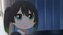a close up of a girl with green eyes and black hair