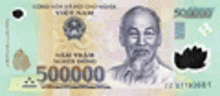 a close up of a vietnamese banknote with a man 's face on it