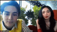 a man and a woman are on a video call and the man is wearing a yellow vest and the woman is wearing a red top