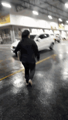a blurry picture of a person running in front of a car