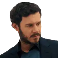 a man with a beard wearing a suit and a blue shirt