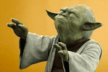 a close up of a statue of yoda with his eyes closed .