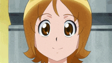 a close up of a cartoon girl 's face with big eyes