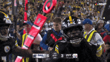 a football game between dallas and pittsburgh is being played