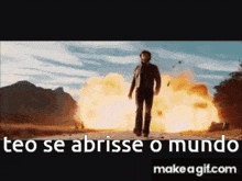a man is standing in front of a large explosion with the words " ceo se abrisse o mundo " below him