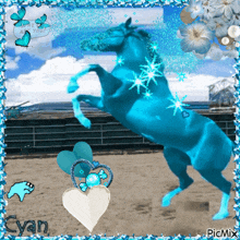 a blue horse is standing on its hind legs in front of a fence