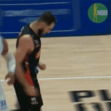 a man in a basketball uniform with the number 26 on it