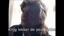 a close up of a man with the words " krijg lekker de pest pokke " below him