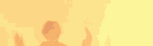 a shadow of a person with their hands up on a yellow background .