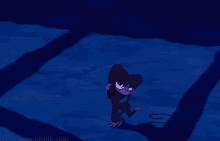 a purple monkey is hanging upside down on a blue surface