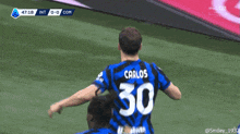 a soccer player with the number 30 on their jersey