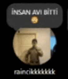 a man is taking a selfie in a mirror with a smiley face .