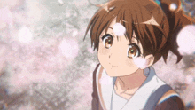 a girl in a ponytail looks up at the sky