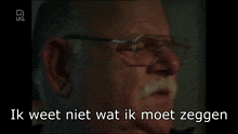 a man with glasses and a mustache says maar die jongens is gewoon in a foreign language