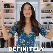 a woman in a blue dress is saying definitely