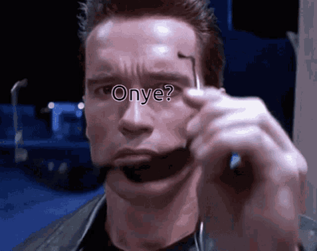 a close up of arnold schwarzenegger 's face with the word onye written on his face