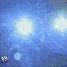 a w logo is on a blue background with a person in the background