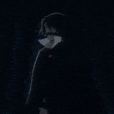 a blurry picture of a person 's face with a blue background