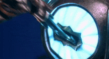 a close up of a machine with a blue light behind it