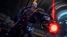 a video game character is holding a red object and says `` hey , get me out of here '' .