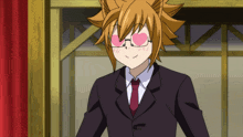 a man in a suit has a heart shaped eye