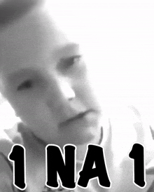 a black and white photo of a person with the words 1na1 written below them