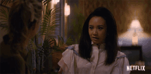 a woman talking to another woman with a netflix logo on the bottom