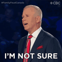 a man in a suit and tie says that he is not sure