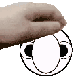 a close up of a person 's hand holding a cartoon face .