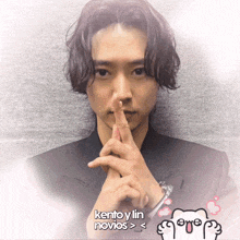 a picture of a man making a silence gesture with kento y lin novios written below him