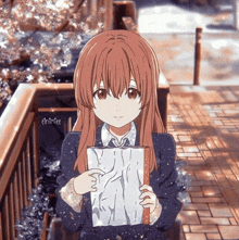 a picture of a girl holding a piece of paper with the name elninfee on the bottom right