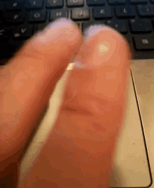fingers tapping touchpad