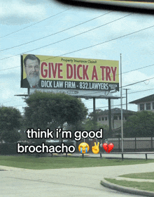a billboard that says give dick a try with a picture of a man