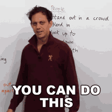 a man stands in front of a white board with the words " you can do this " on it