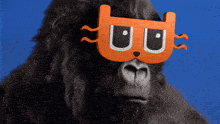 a gorilla wearing a mask with the letter b on it 's face