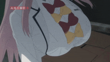 a close up of a girl 's breasts with the word anime above her
