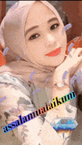 a woman wearing a hijab with the words assalamualaikum written on it