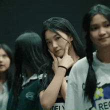 a girl wearing a white t-shirt with the word rec on the front