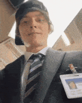 a man in a suit and tie with a name tag that says ' chris '