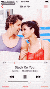 a man and a woman are looking at each other while playing stuck on you by meiko