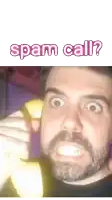 a man with a beard is talking on a banana phone with the words spam call behind him