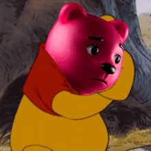 a winnie the pooh cartoon character with a pink head