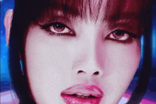 a close up of a woman 's face with a purple background