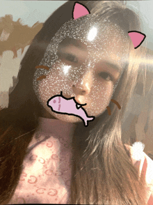 a girl wearing a mask with a fish and cat ears on her face