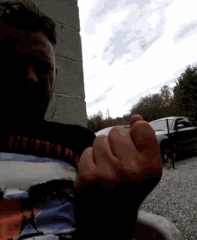 a man wearing a shirt that says ' g.v.v.r. ' on it